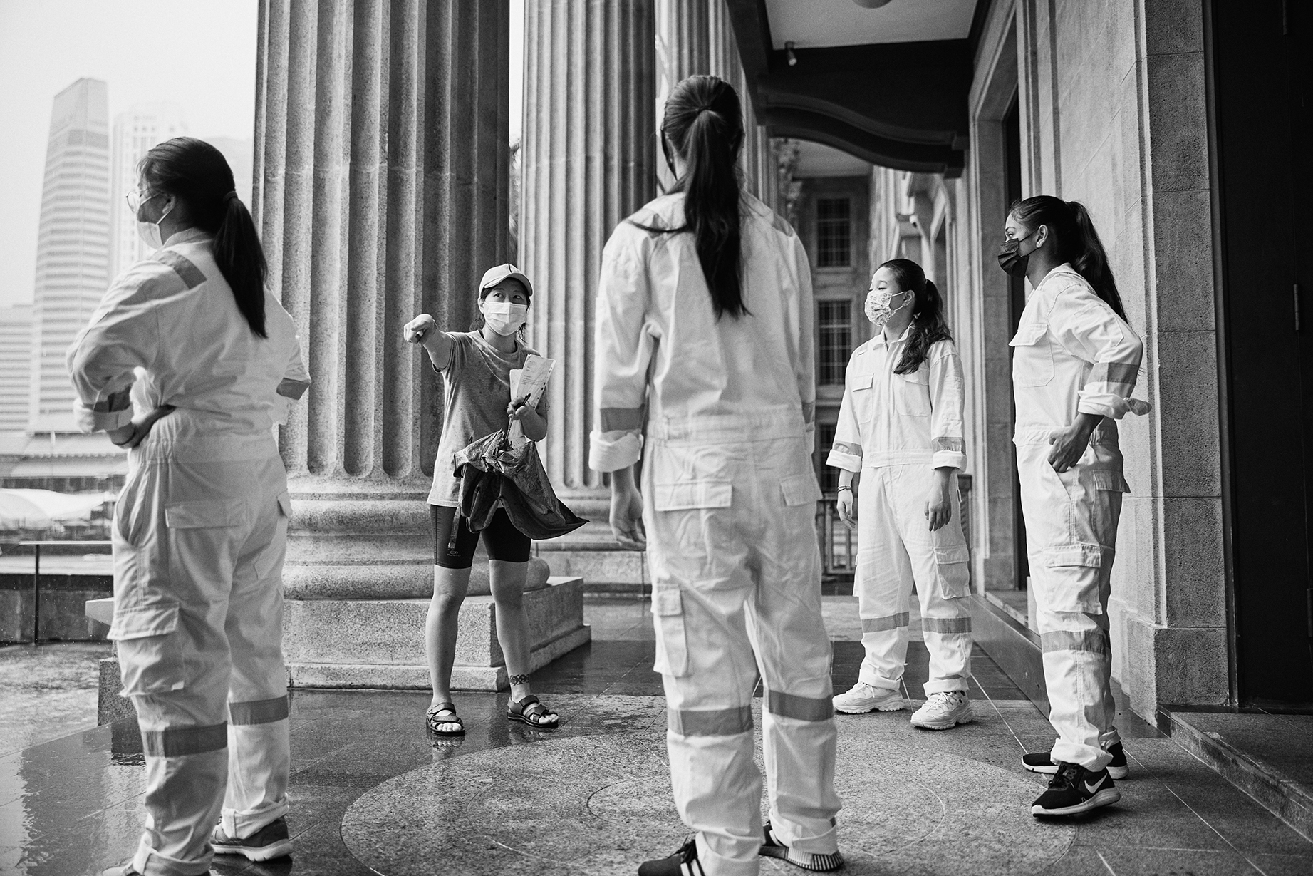 Performance artist Pat Toh directs students outside the National Gallery